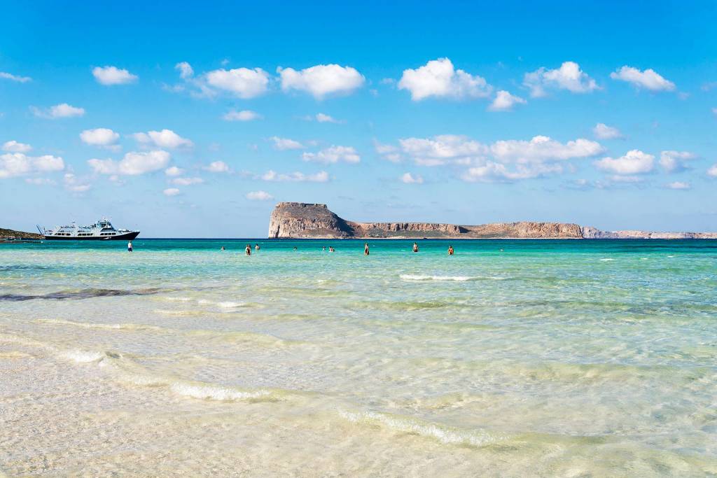 A ship sails from Balos Beach to Gramvousa Island.
