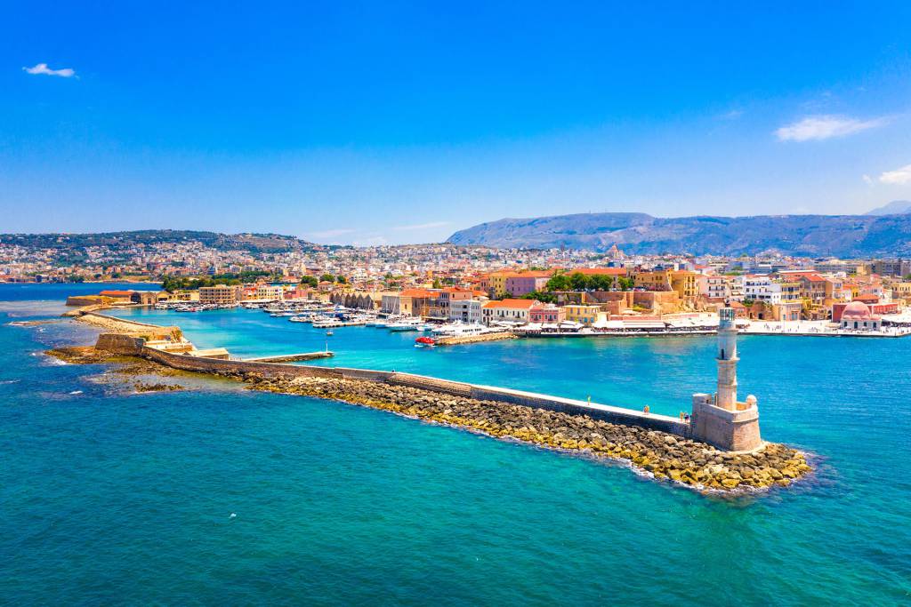 View of the famous Egyptian Lighthouse, the sea, and the picturesque Chania Old Harbor.