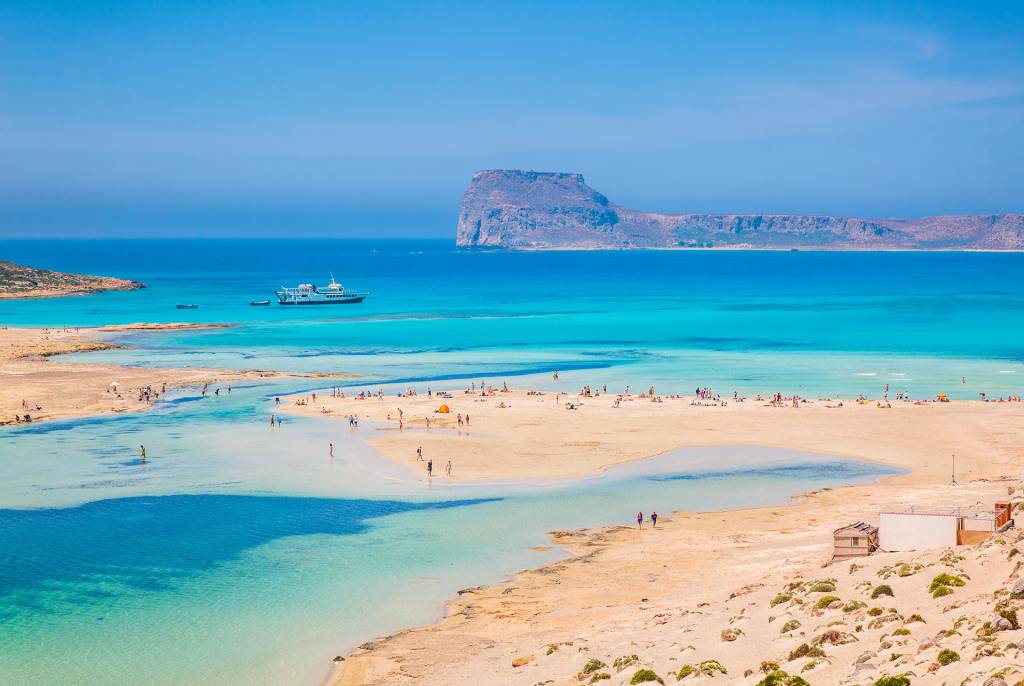 View of Balos Beach, Gramvousa Island, and a ship sailing.