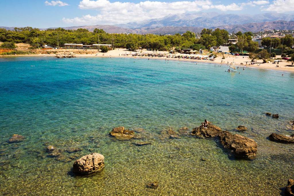 People enjoy Agii Apostoli Beach.