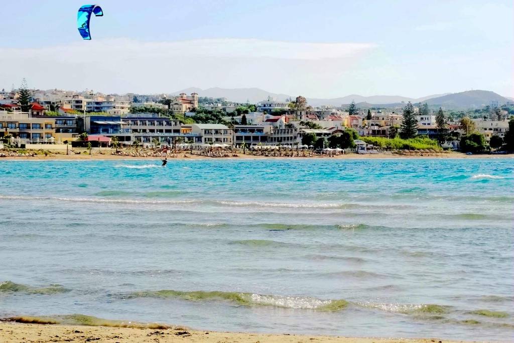 A man parasailing in Agii Apostoli Beach.