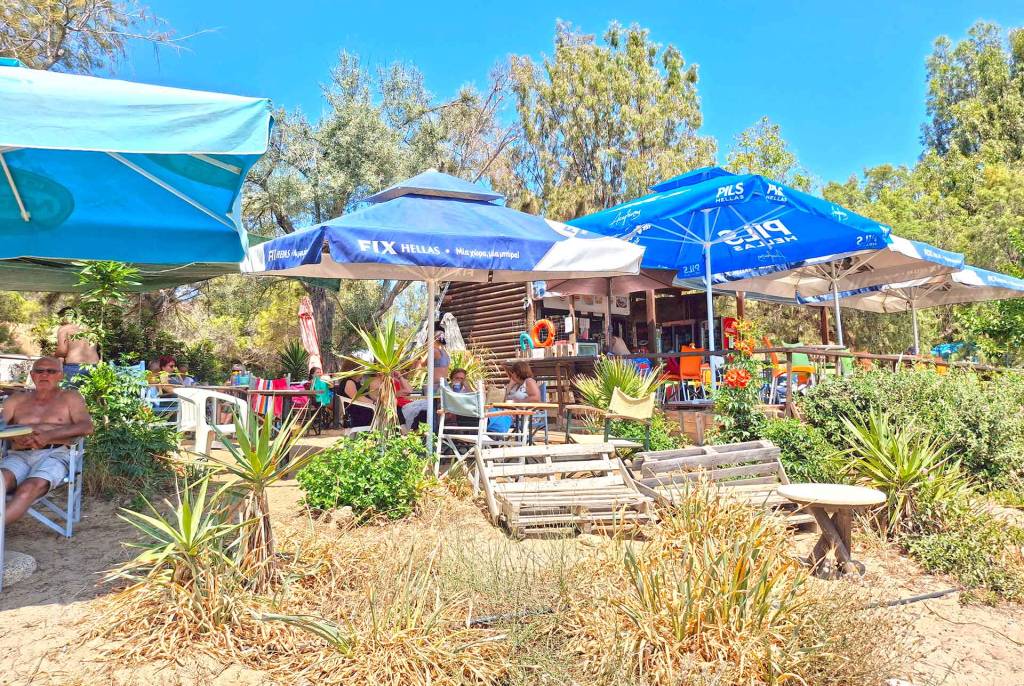Anemos seaside cafe with umbrellas in Chrissi Akti Beach (Chania).