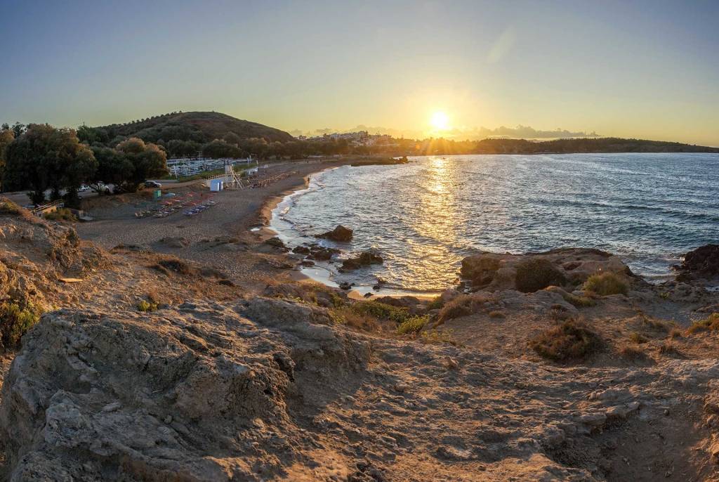 Romantic sunset view of Chrissi Akti Beach, in Chania.