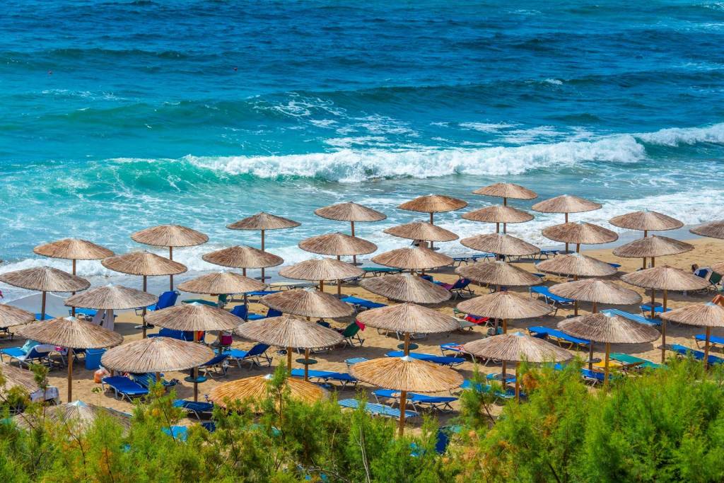Sunbeds and umbrellas in Falassarna Beach.