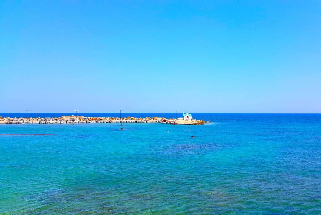 A picturesque church by the sea in Galatas Village.
