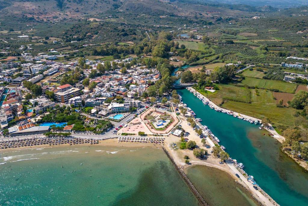 The river, seaside hotels and apartments, and the beach of Georgioupolis.