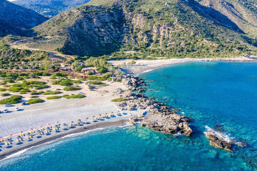 Sunbeds and umbrellas in Gialiskari Beach.