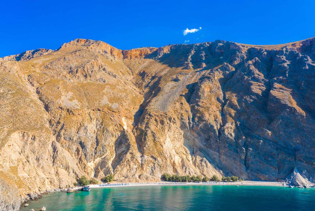 The rocky mountains above Glyka Nera Beach.