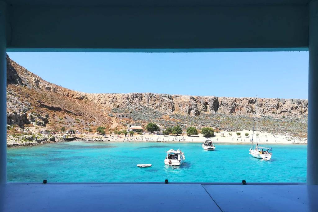 The view of Gramvousa Beach, the surrounding area, and the catamarans from a ship.