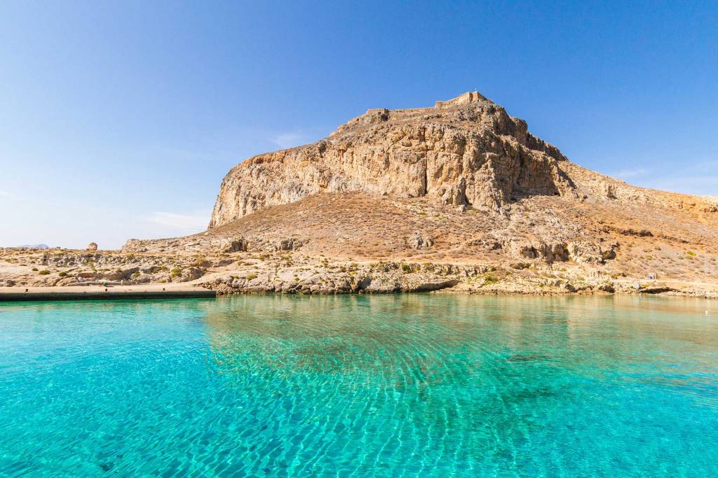 The small port of Gramvousa is below an impressive cliff where the castle stands.