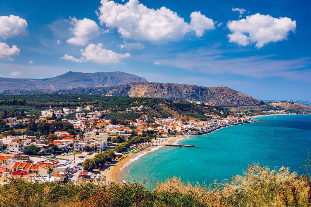 The seaside Kalyves Village in Chania, the sea, and the mountains.