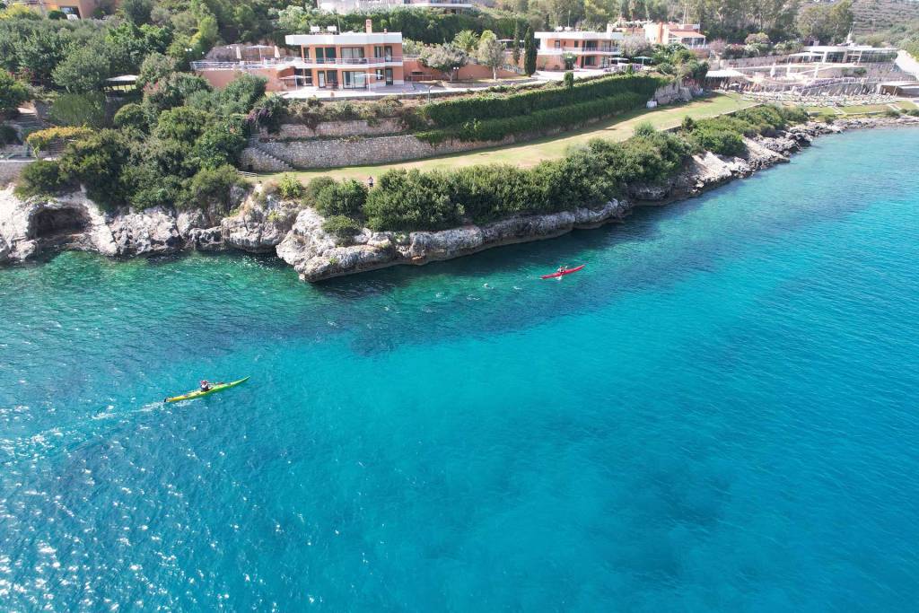 People on kayaks in Loutraki Beach.