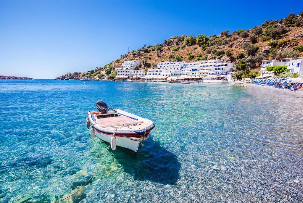 A small fishing boat in the waters of Loutro Beach.