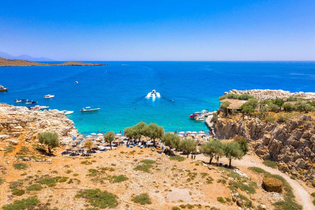 A private boat leaves Marmara Beach in South Chania.