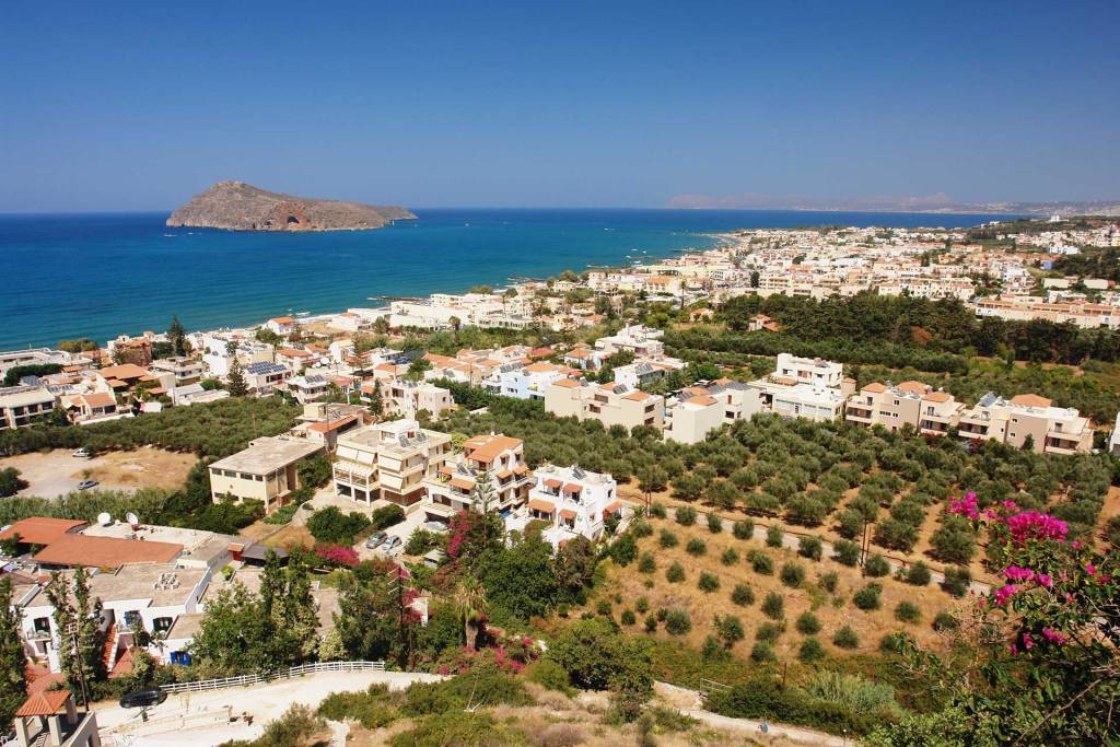 Houses and hotels in Platanias overlooking Thodorou Island.