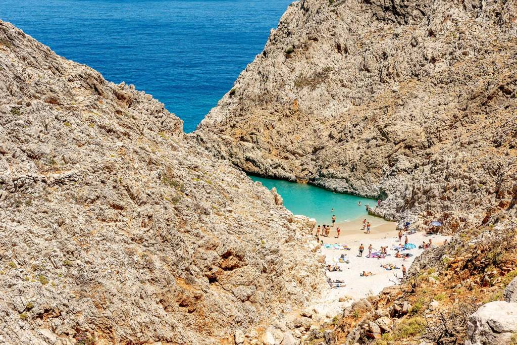 People on the coast and sea of Seitan Limania Beach.