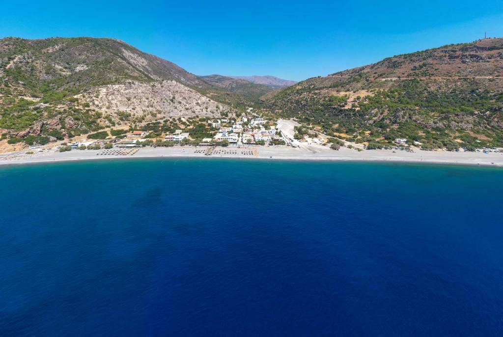 Aerial view of sunbeds in Sougia Beach.
