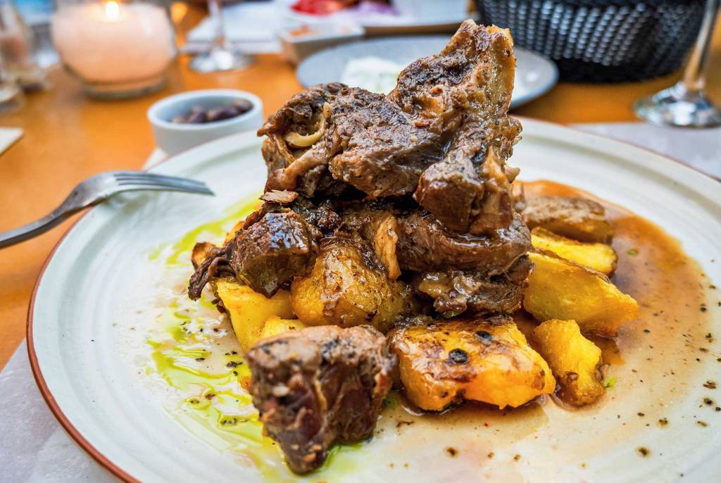 Tsigariasto (goat) meat with baked potatoes.