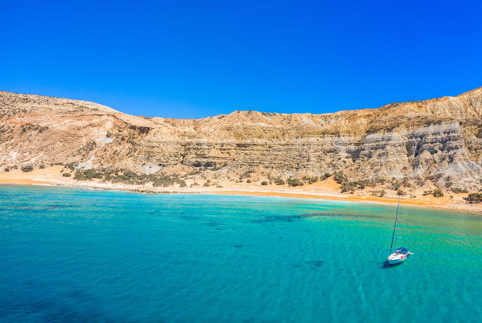 A catamaran sails from Potamos Beach in Gavdos.