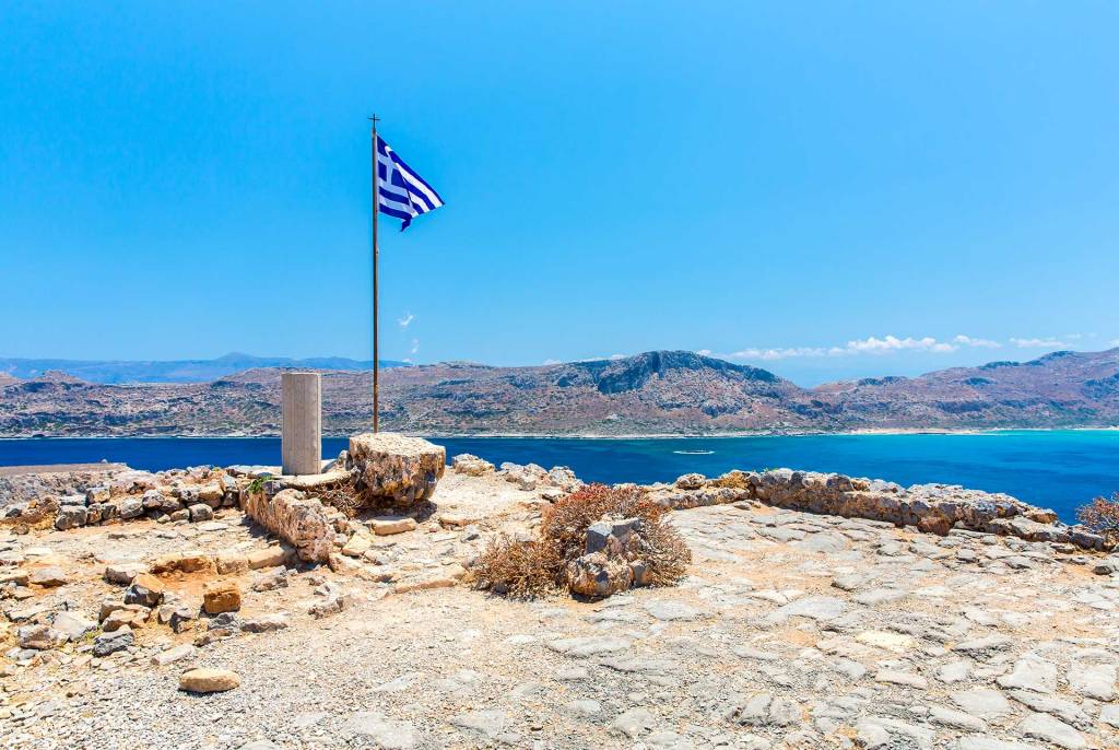 A Greek flag waving on Gramvousa Fortress.