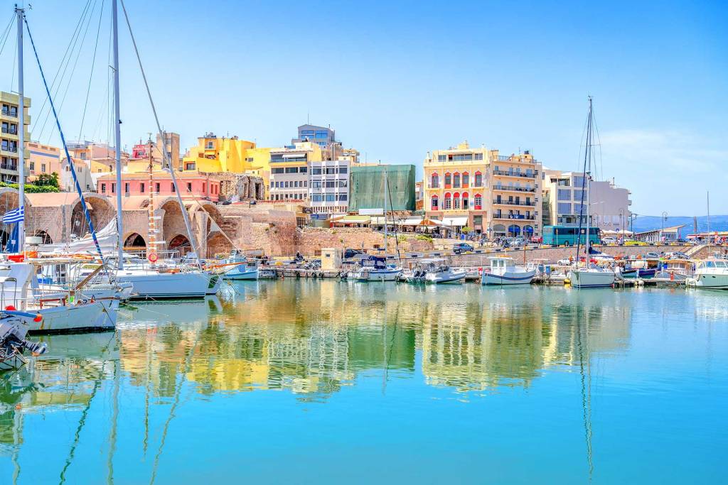 Fishing boats and catamarans in the picturesque Heraklion Old Harbor.
