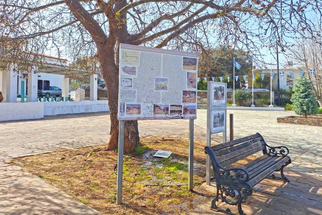 A bench and a sign about Ancient Kandanos.