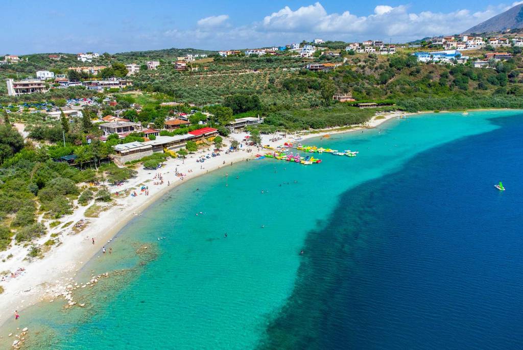 Seaside taverns and pedal boat rentals in Lake Kournas.