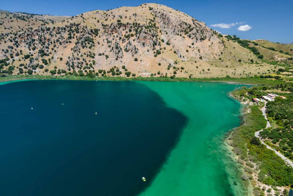 The turquoise waters and the mountain above Lake Kournas in Chania.