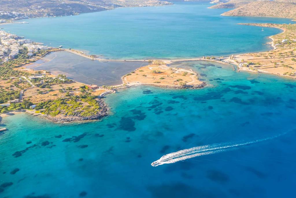 A private boat crossing the waters of Elounda.