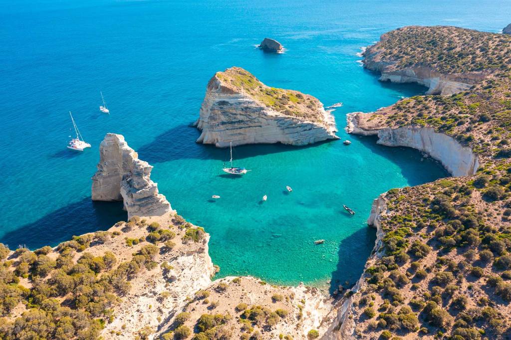 Catamarans in Kleftiko Bay of Milos Island.