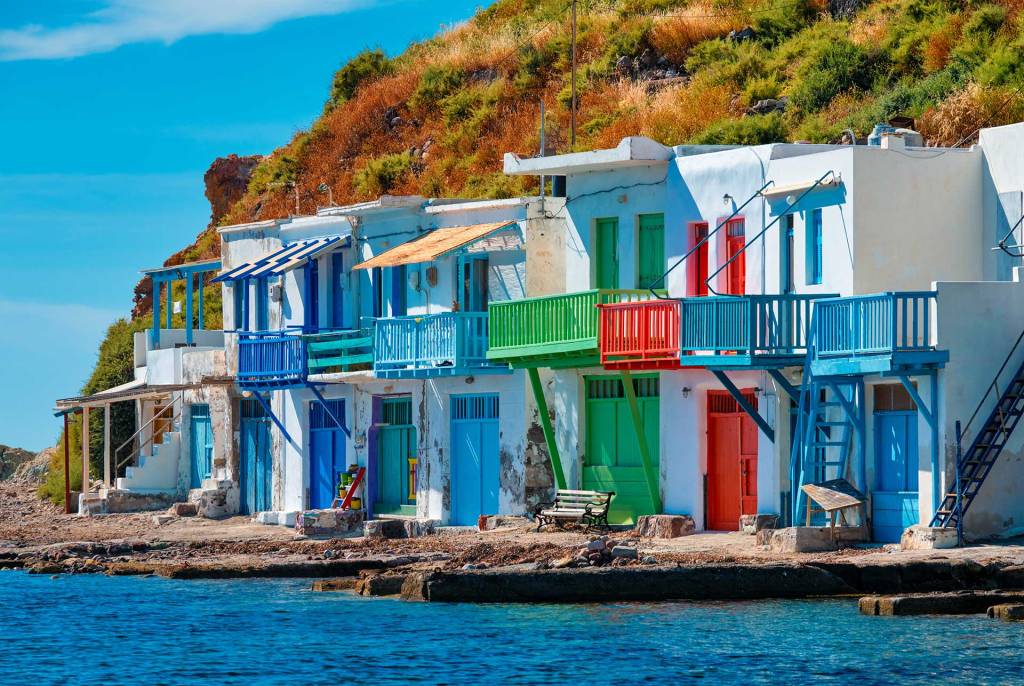 White-washed houses with colorful doors in Klima Village (Milos Island).