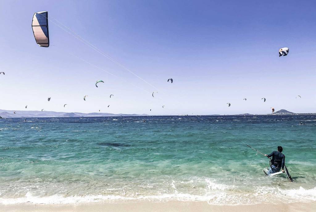 Kitesurfers on a beach in Naxos.
