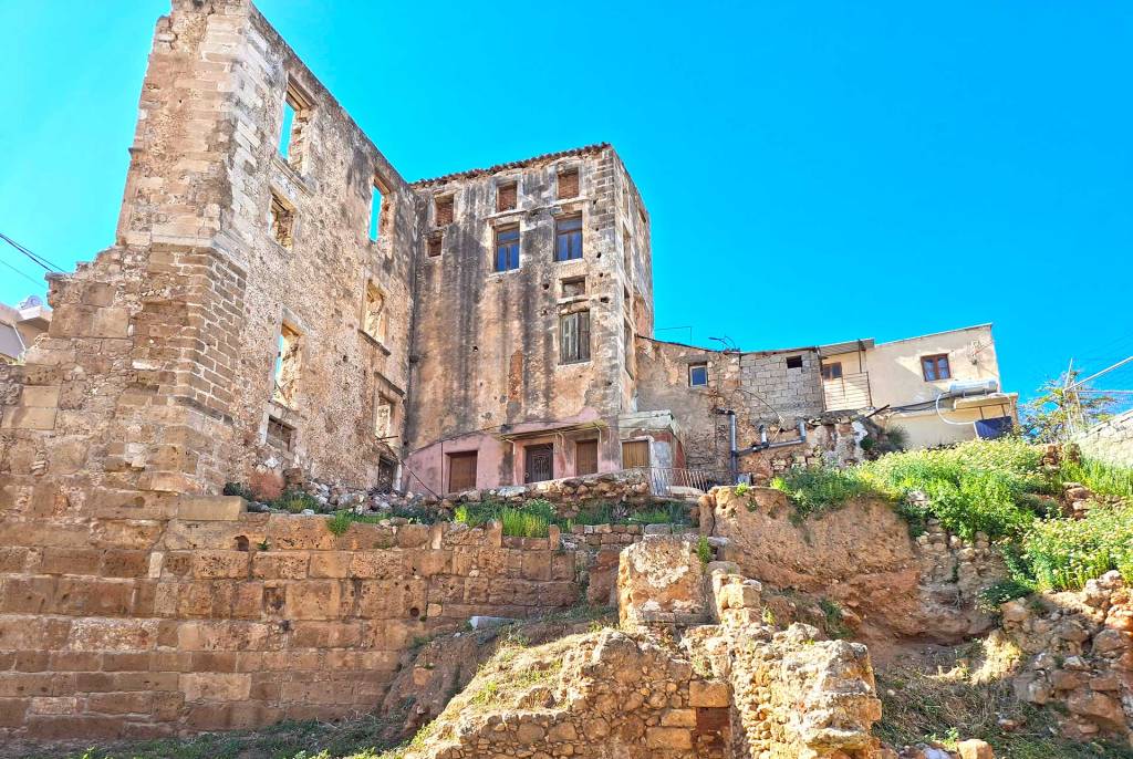 The Byzantine Walls of Chania next to some houses.