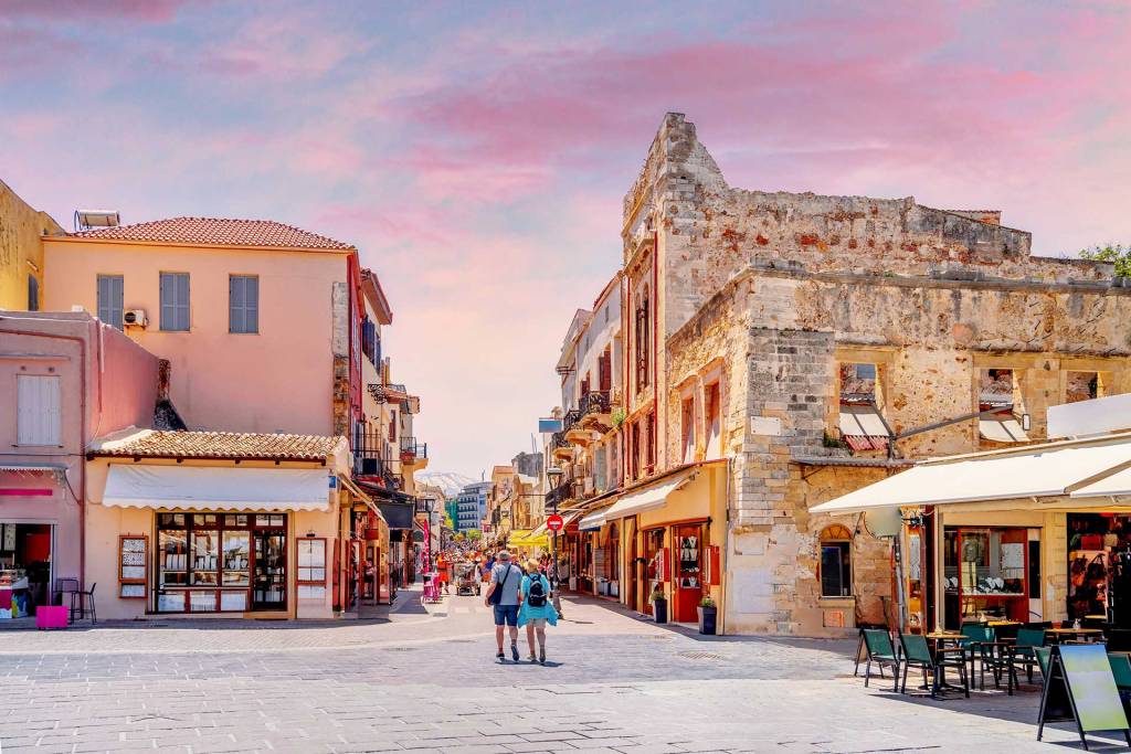 Tourists walk towards Chalidon Street in Chania Old Town.