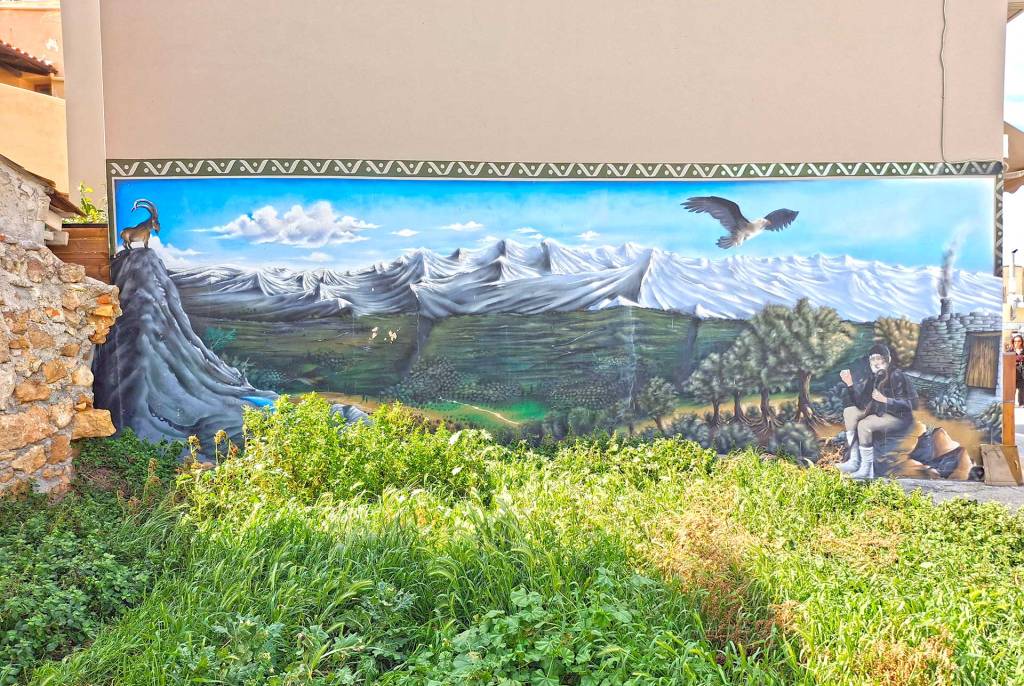 A cool graffiti piece featuring a Cretan Goat (Kri Kri) in the mountains of Chania, alongside a shepherd.