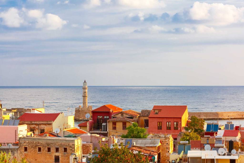 Picturesque buildings in Chania Old Town overlooking the lighthouse.