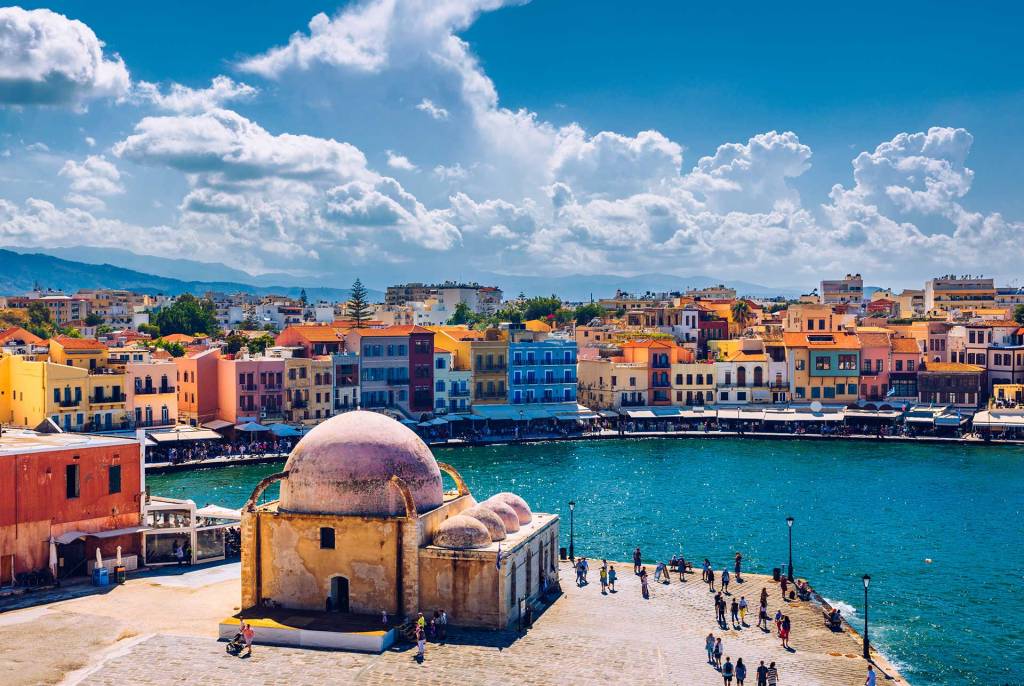 Tourists next to the Küçük Hasan Pasha Mosque, on the Old Harbor of Chania.