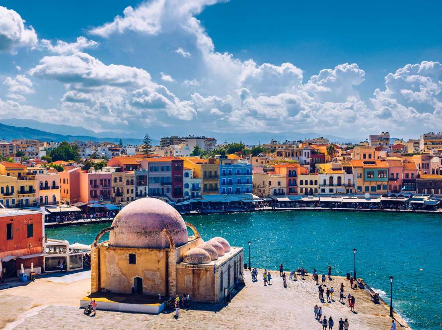Tourists next to the Küçük Hasan Pasha Mosque, on the Old Harbor of Chania.