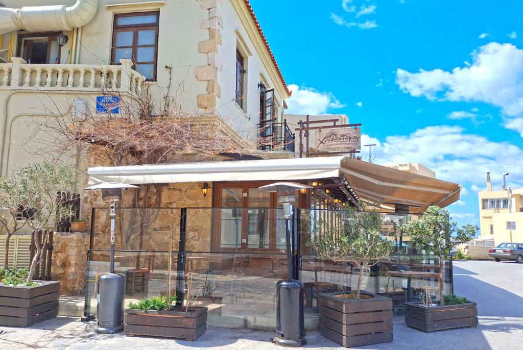 The exterior covered area, next to the entrance of the awarded Chrisostomos Restaurant in Chania Old Harbor.