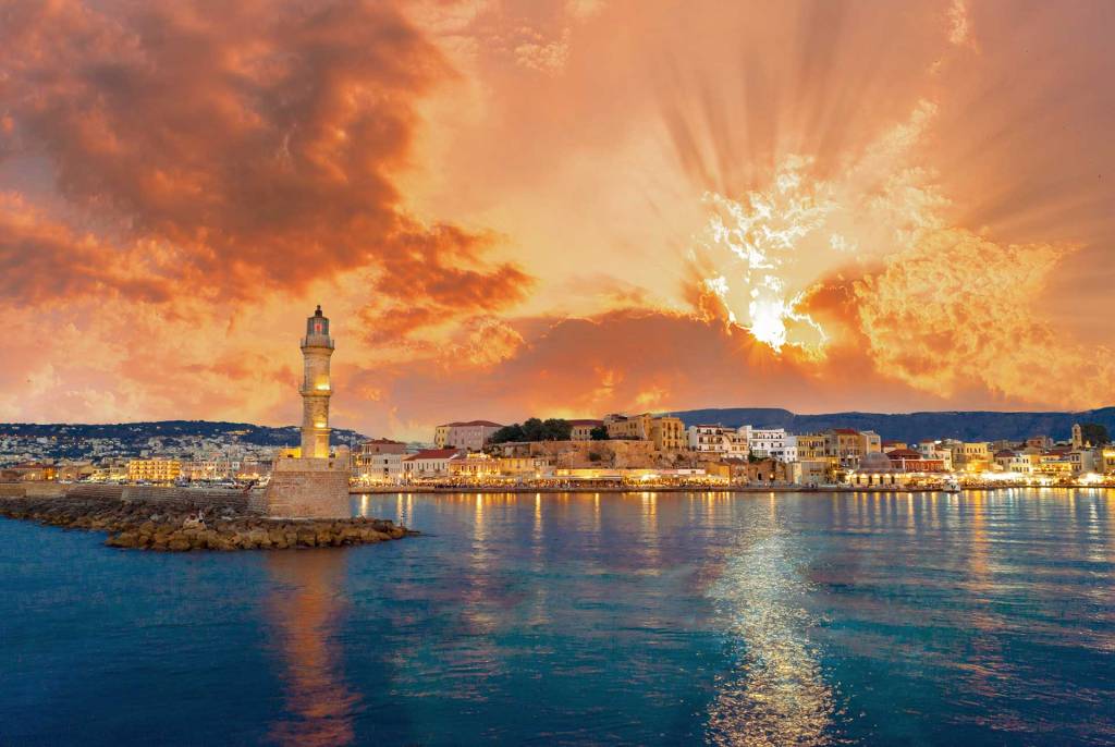 Romantic sunset above the Egyptian Lighthouse and the Old Harbor of Chania.