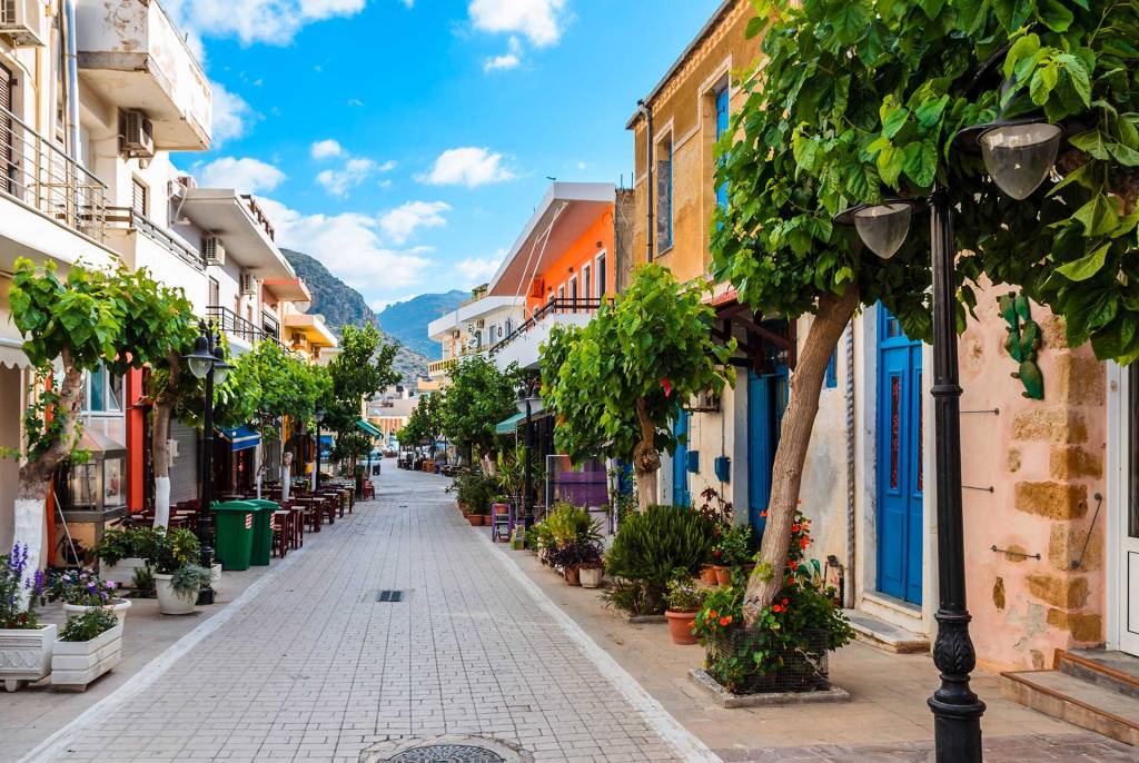 A street with cafes, bars, and shops in the heart of Paleochora in Chania.