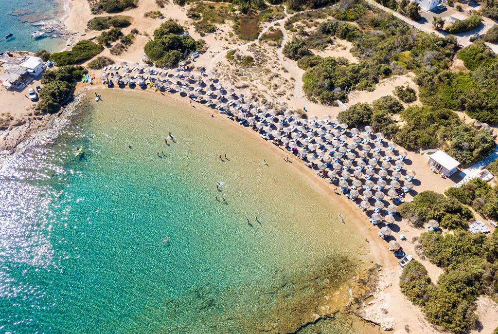 Aerial view of the sandy, organized Santa Maria Beach in Paros.