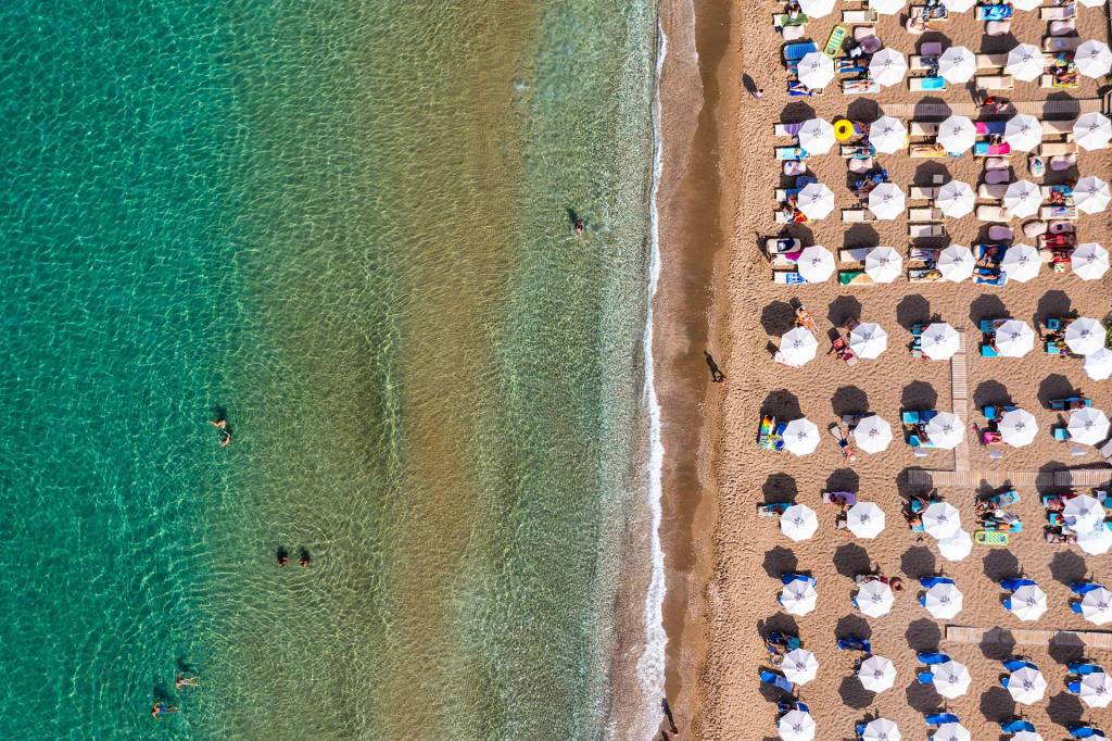 Umbrellas in the organized Tsampika Beach on Rhodes Island.