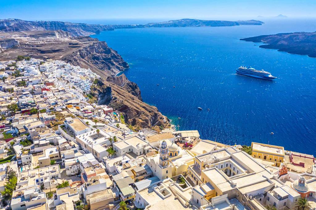 A big cruise ship overlooking the Caldera and Imerovigli in Santorini.