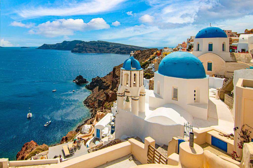 White-washed houses and picturesque churches on Santorini Island.