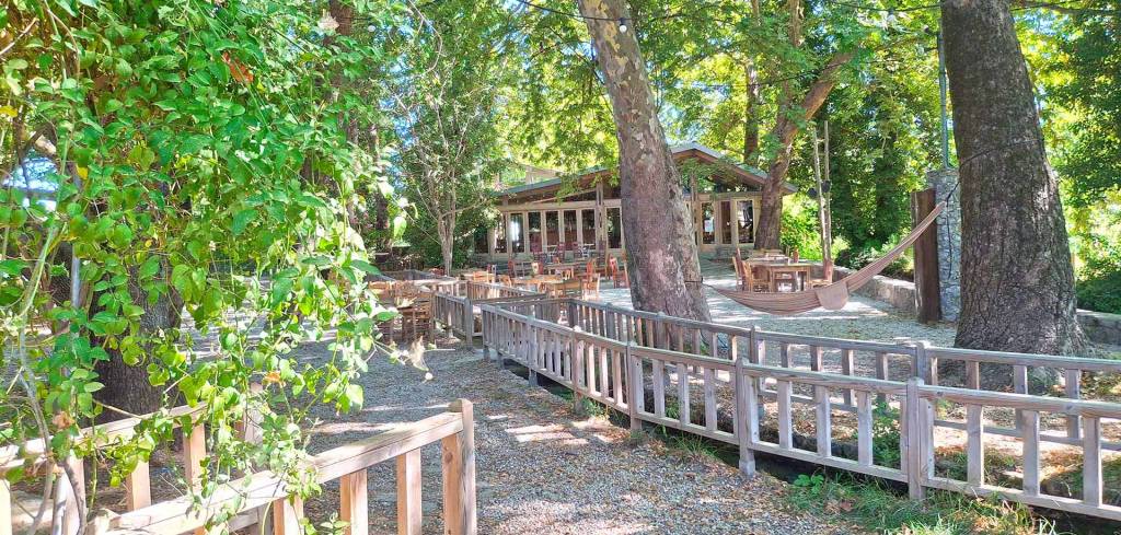 Lush vegetation around a cozy wooden-built cafe in Armeni Village (Apokoronas, Chania).