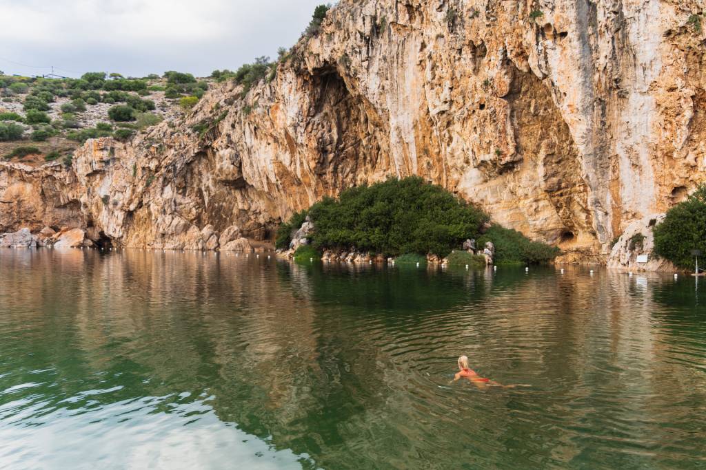 People swimming in Athens Lake Vouliagmeni.