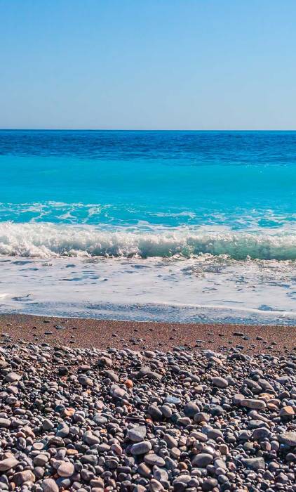 Pebbles on the coast of Domata Beach.