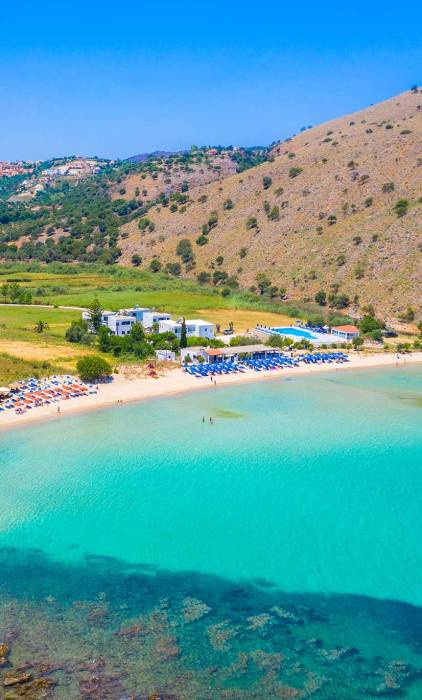 Umbrellas, sunbeds, and hotels in Georgioupolis.