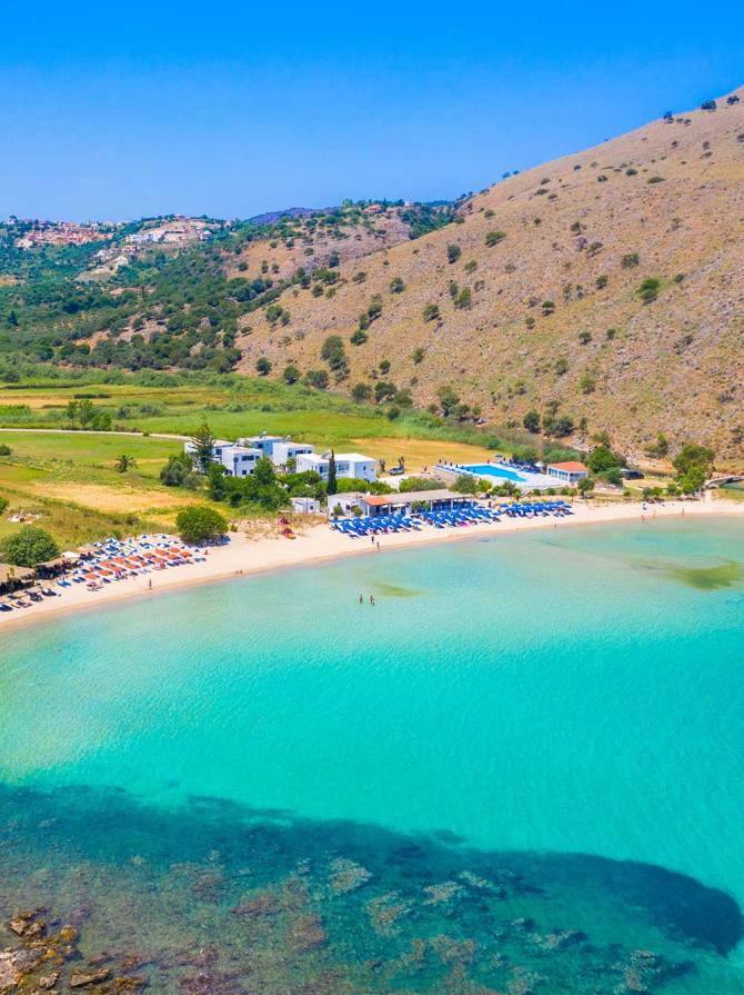 Umbrellas, sunbeds, and hotels in Georgioupolis.